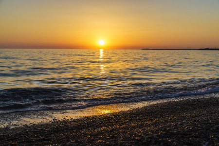 Beautiful sunset over the Mediterranean sea in summer as background in Sicily, Italyの写真素材