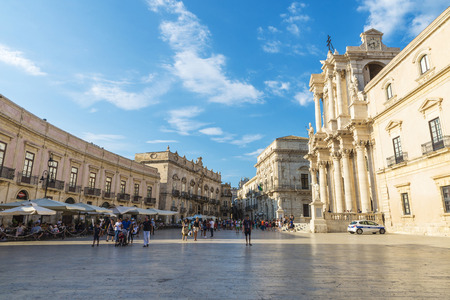 Siracusa, Italy - August 17, 2017: Piazza Duomo and the cathedral with police patrol and people around in the old town of the historic village of Siracusa in Sicily, Italyのeditorial素材