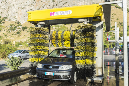 Sicily, Italy - August 19, 2017: Car of the Fiat brand in an automatic washing car at a gas station in Sicily, Italyのeditorial素材