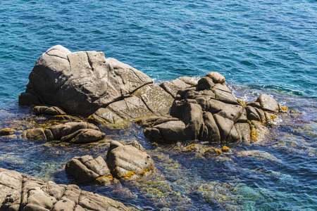 Cliffs with crystal clear water in Costa Brava, Girona, Catalonia, Spainの写真素材