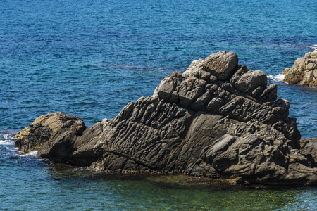 Cliffs with crystal clear water in Costa Brava, Girona, Catalonia, Spainの写真素材