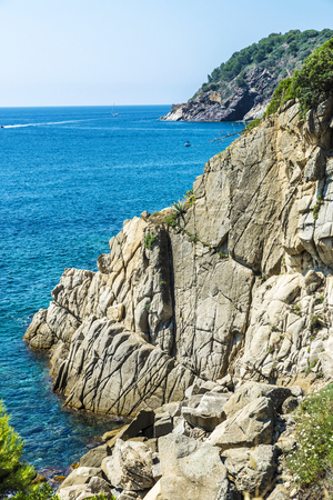Cliffs with crystal clear water in Costa Brava, Girona, Catalonia, Spainの写真素材