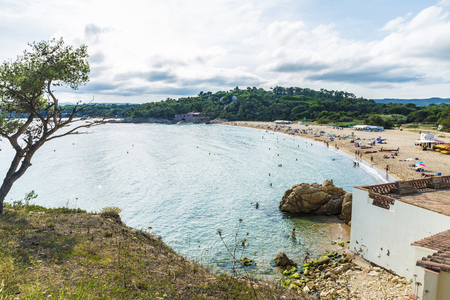 View of Castell beach with people bathing in Palamos, Costa Brava, Girona, Catalonia, Spainの写真素材