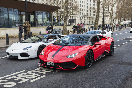 London, United Kingdom - January 1, 2017: Parade of Lamborghini Aventador on a street with people around in London, England, United Kingdomのeditorial素材