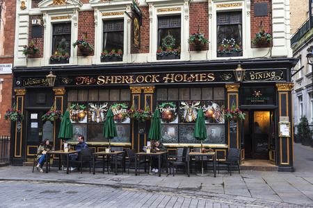 London, United Kingdom - January 1, 2017: Typical english pub called the Sherlock Holmes  with people around in London, England, United Kingdomのeditorial素材