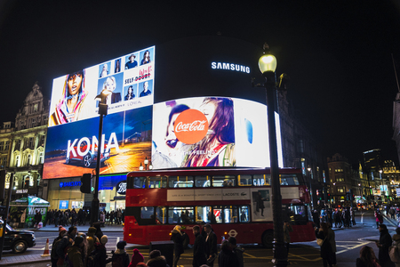 London, United Kingdom - January 3, 2018: Piccadilly Circus at night with its huge advertising screens and people around in London, England, United Kingdomのeditorial素材