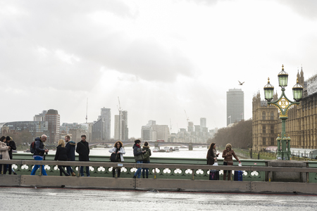 London, United Kingdom - January 4, 2018: People on a bridge of the river Thames in London in England, United Kingdomのeditorial素材