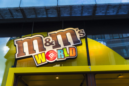 London, United Kingdom - January 4, 2018: Logo of M&M's shop, famous by its colorful button-shaped...