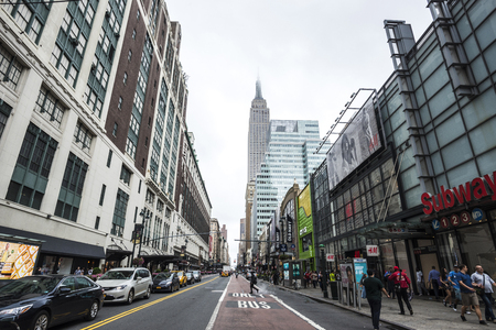 New York City, USA - July 25, 2018: 34th Street with Empire State building in the background and people around in Manhattan in New York City, USAのeditorial素材