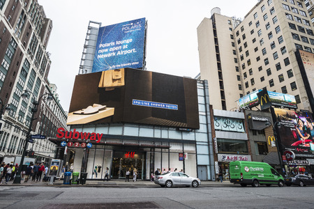 New York City, USA - July 25, 2018: Seventh Avenue and 34th Street with huge advertising screens and people around in Manhattan in New York City, USAのeditorial素材