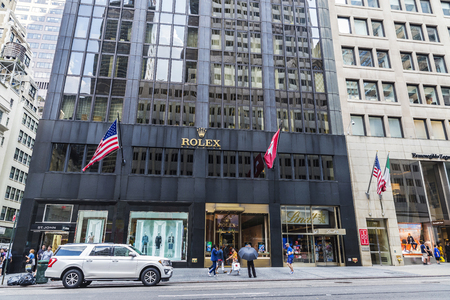 New York City, USA - July 28, 2018: Fifth Avenue (5th Avenue) with luxury shops like Rolex or Ermenegildo Zegna and people around in Manhattan in New York City, USAのeditorial素材