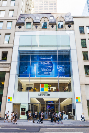 New York City, USA - July 28, 2018: Microsoft Corporation (MS) shop, multinational technology company, in Fifth Avenue (5th Avenue) with people around in Manhattan in New York City, USAのeditorial素材