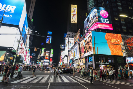 New York City, USA - July 30, 2018: Times Square at night with people around and large advertising screens in Manhattan in New York City, USAのeditorial素材
