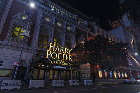 New York City, USA - July 30, 2018: Lyric Theatre where they do the play Harry Potter and the Cursed Child next to Times Square at night with people around in Manhattan in New York City, USAのeditorial素材