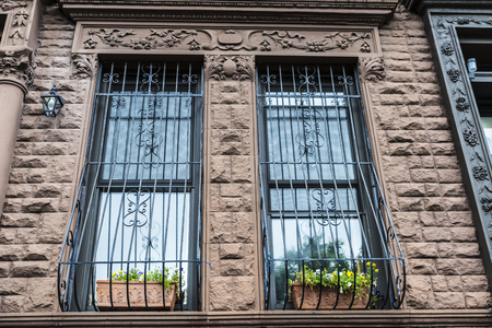 Old typical houses in the Harlem neighborhood in Manhattan, New York City, USAの写真素材