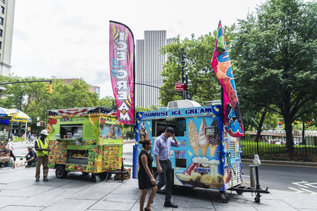 New York City, USA - July 26, 2018: Food truck with people around on a street in Manhattan in New York City, USAのeditorial素材