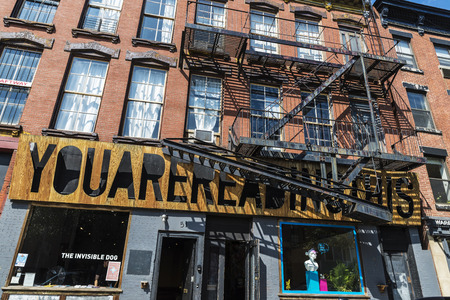 New York City, USA - July 26, 2018: Old typical houses with a contemporary art gallery in the Brooklyn neighborhood in Manhattan, New York City, USAのeditorial素材