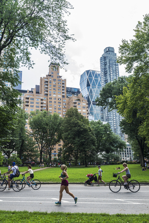 New York City, USA - July 28, 2018: Cyclists and runners on summer in Central Park, Manhattan, New York City, USAのeditorial素材