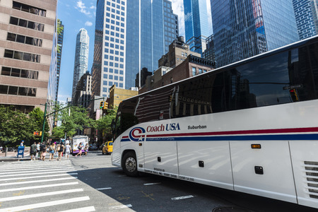 New York City, USA - July 28, 2018: 8th Avenue (Eight Avenue) with its modern skyscrapers and a bus...