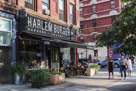 New York City, USA - July 29, 2018: Terrace of Harlem Burger on summer with people around in Harlem, Manhattan, New York City, USAのeditorial素材