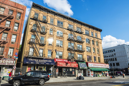 New York City, USA - July 29, 2018: Grocery, restaurant and other stores with people around in Harlem, Manhattan, New York City, USAのeditorial素材