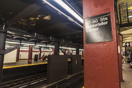 47-50 Sts Rockefeller Center subway station with people waiting in New York City, USAのeditorial素材