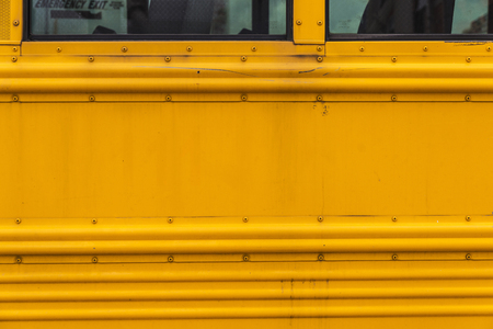 Bodywork of an old yellow school bus parked in Coney Island, New York City, USA