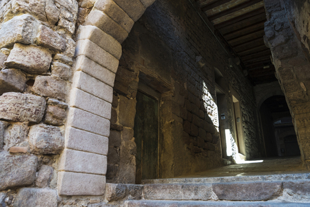 Old stone passage in the old town of the medieval city of Cardona in Catalonia, Spainの写真素材