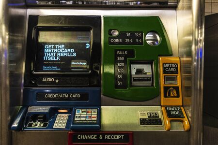 New York City, USA - July 31, 2018: Subway ticket vending machine for payment in cash or by credit...