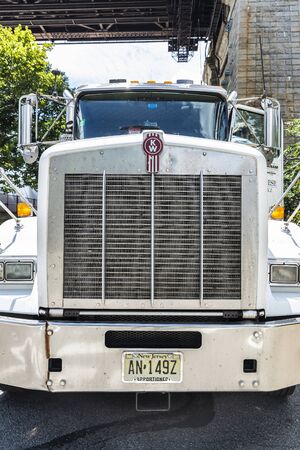 New York City, USA - July 31, 2018: White Kenworth brand truck parked on a street with the driver going down in New York City, USAのeditorial素材