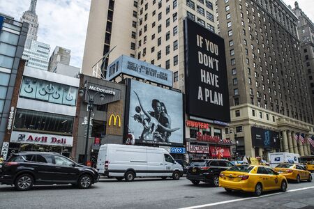 New York City, USA - July 31, 2018: Seventh Avenue and 34th Street with huge advertising screens, traffic and people around in Manhattan in New York City, USAのeditorial素材