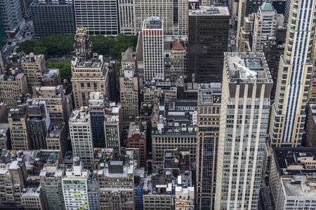 Elevated view of a street with its skyscrapers, traffic and people around in Manhattan, New York City, USAの写真素材