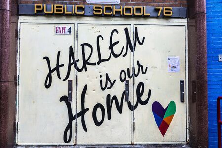 New York City, USA - August 1, 2018: Sign of Harlem is our home at the entrance of a public school in Harlem, Manhattan, New York City, USAのeditorial素材