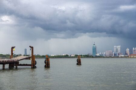 View of the skyline of modern skyscrapers from the Liberty Island pier in New York City, USA