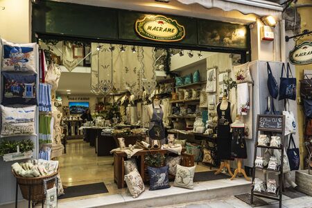 Athens, Greece - December 31, 2018: Vendor in a traditional macrame and embroidery greek shop in Athens, Greeceのeditorial素材