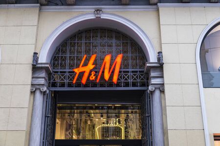 Athens, Greece - January 4, 2019: Display of a HM store at night in Athens, Greeceのeditorial素材