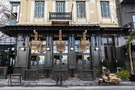 Athens, Greece - January 1, 2019: Bar called Tony Bonanno with a Vespa painted in gold as decoration in Athens, Greeceのeditorial素材