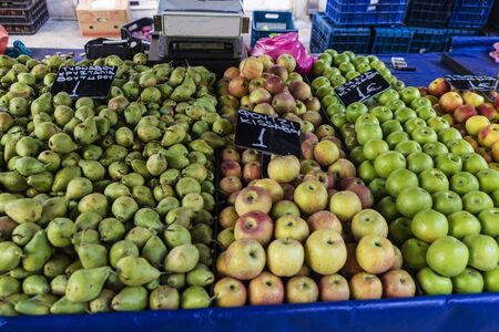 Fruit stand with apples and pears in a farmer market on a street in Athens, Greeceの写真素材