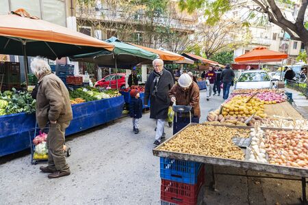 Athens, Greece - January 4, 2019: Farmer Market on a street with people choosing fruit and vegetables in Athens, Greeceのeditorial素材