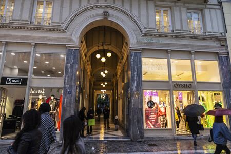 Athens, Greece - January 4, 2019: Shopping street with clothing stores with people around in Athens, Greeceのeditorial素材
