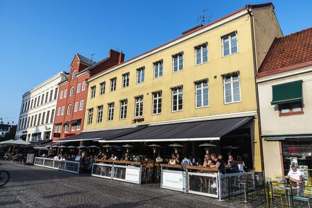 Malmo, Sweden - August 28, 2019: Lilla Torg, a square with many bars, restaurants and shops in the old town of MalmÃ¶ with people around in Swedenのeditorial素材