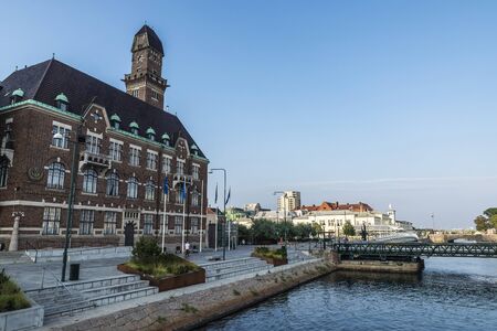 MalmÃ¶, Sweden - August 28, 2019: Facade of the old classic World Maritime University with people...