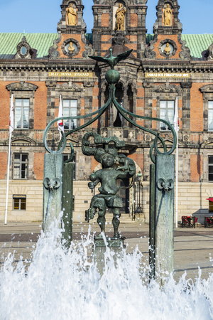 Fountain and the old classic Malmo City Hall in Stortorget, a large plaza in the center of Malmo in Swedenのeditorial素材