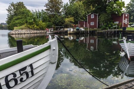 Pier with boats in Fiskehoddorna, traditional fish market on a street in Sweden の写真素材