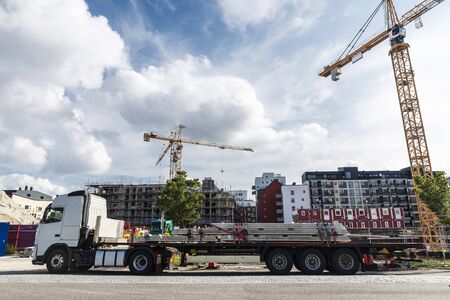 Truck loaded with concrete beams in a construction site in Vastra Hamnen, Malmo, Sweden の写真素材
