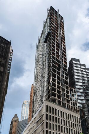 Construction of a modern skyscraper in Manhattan, New York City, USAの写真素材