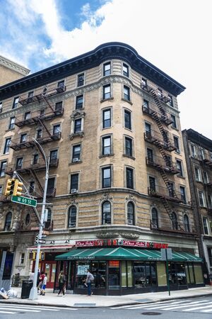 New York City, USA - August 3, 2018: West Side restaurant in W 69th Street with people around in...