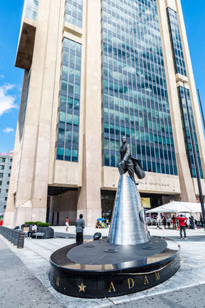 New York City, USA - August 4, 2018: Facade of the Adam Clayton Powell Jr. State Office Building and its bronze sculpture with people around in Harlem, Manhattan, New York City, USAのeditorial素材