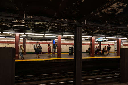 New York City, USA - August 4, 2018: People waiting a train in the Rockefeller Center subway station of New York City, USAのeditorial素材