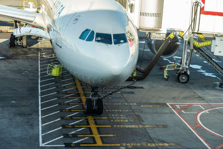 New York City, USA - August 4, 2018: Delta Air LInes airplane with a finger parked at John F. Kennedy International Airport (JFK Airport, JFK or Kennedy) in Queens, New York City, USAのeditorial素材